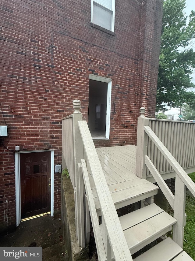 1113 Faunce St, Philadelphia, PA 19111 - doorway to property with a deck and brick siding