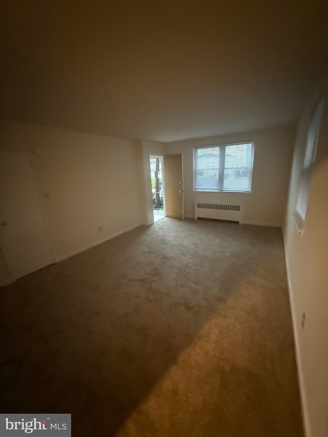 1113 Faunce St, Philadelphia, PA 19111 - spare room featuring radiator heating unit, carpet flooring, and baseboards