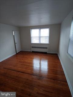 1113 Faunce St, Philadelphia, PA 19111 - unfurnished room featuring radiator heating unit, wood finished floors, and baseboards