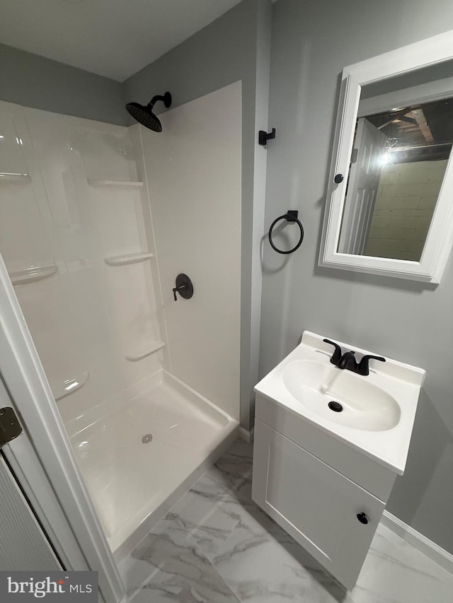 1113 Faunce St, Philadelphia, PA 19111 - bathroom with marble finish floors, a shower, vanity, and baseboards