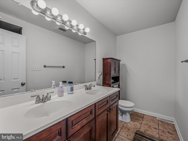 326 Soldier Dr, Bunker Hill, WV 25413 - bathroom featuring baseboards, toilet, and double vanity