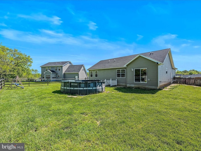 326 Soldier Dr, Bunker Hill, WV 25413 - rear view of house with roof with shingles