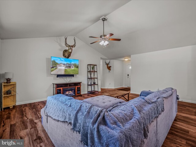 326 Soldier Dr, Bunker Hill, WV 25413 - living room featuring ceiling fan, lofted ceiling, wood finished floors, baseboards, and a lit fireplace