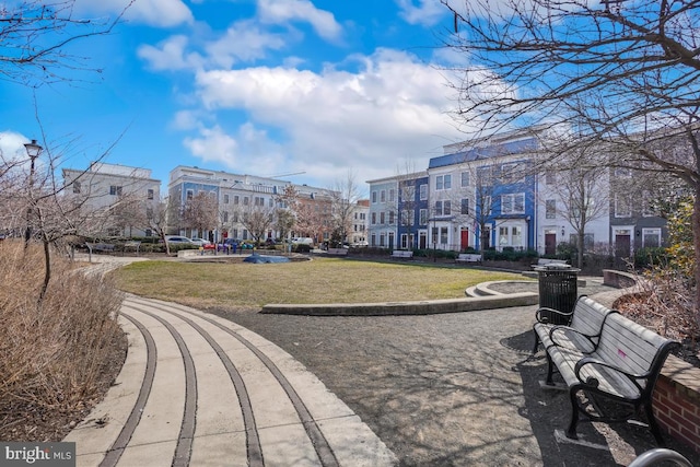 view of property's community featuring a lawn