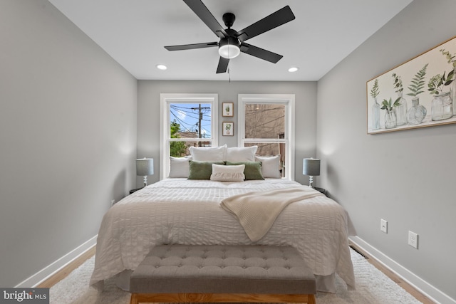 bedroom with wood finished floors, baseboards, recessed lighting, and a ceiling fan