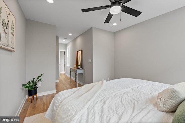 bedroom featuring recessed lighting, wood finished floors, baseboards, and a ceiling fan