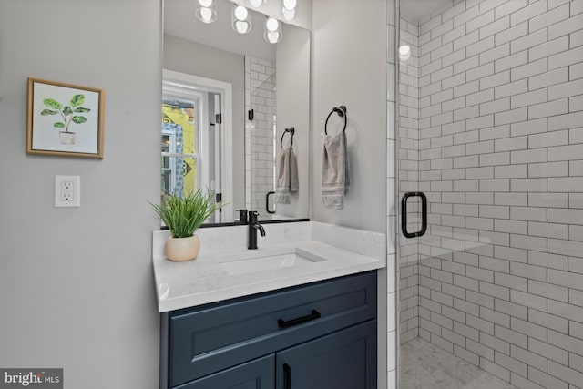 bathroom featuring a stall shower and vanity