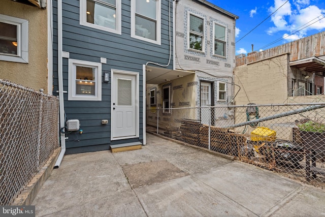 property entrance featuring fence