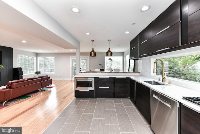 2432 S Culpeper St, Arlington, VA 22206 - kitchen featuring appliances with stainless steel finishes, a sink, recessed lighting, open floor plan, and a peninsula