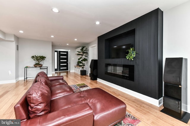 2432 S Culpeper St, Arlington, VA 22206 - living area featuring wood finished floors, recessed lighting, baseboards, and a glass covered fireplace