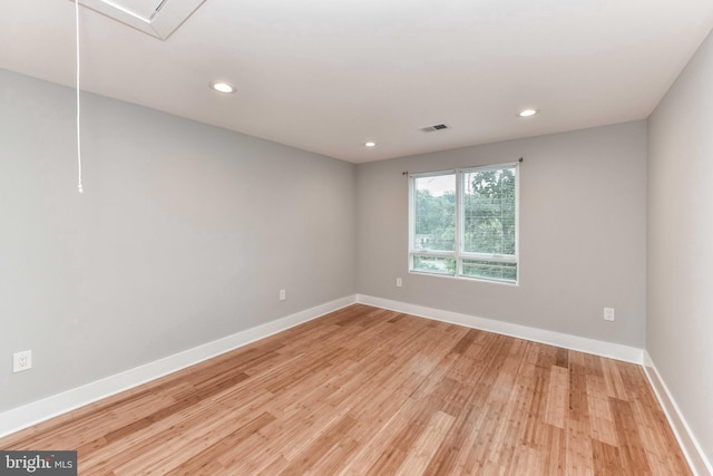 2432 S Culpeper St, Arlington, VA 22206 - empty room with light wood finished floors, baseboards, recessed lighting, and attic access