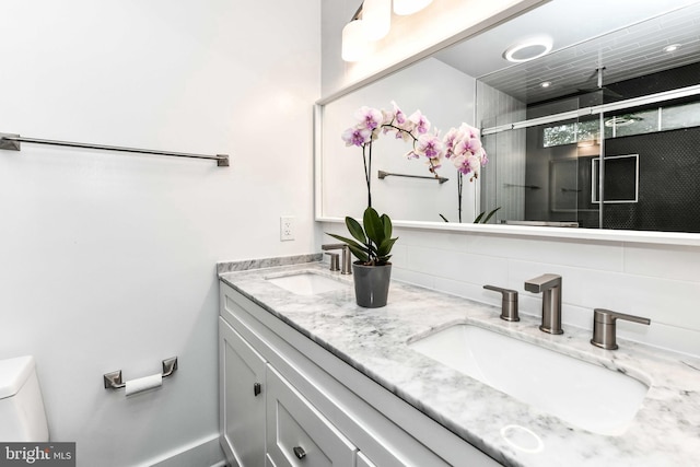 2432 S Culpeper St, Arlington, VA 22206 - full bathroom featuring a shower stall, double vanity, toilet, and tasteful backsplash