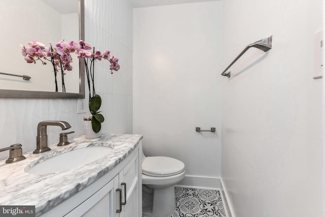 2432 S Culpeper St, Arlington, VA 22206 - half bathroom featuring tile patterned floors, vanity, toilet, and baseboards