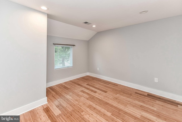 2432 S Culpeper St, Arlington, VA 22206 - empty room with vaulted ceiling, baseboards, light wood-style floors, and recessed lighting