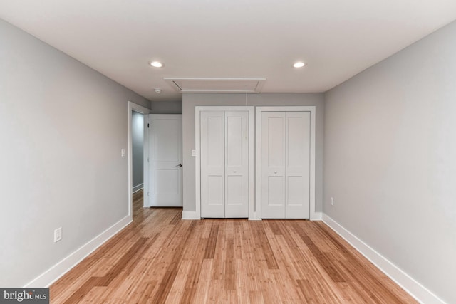 2432 S Culpeper St, Arlington, VA 22206 - unfurnished bedroom with attic access, multiple closets, baseboards, recessed lighting, and light wood-style floors