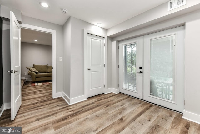2432 S Culpeper St, Arlington, VA 22206 - entrance foyer featuring french doors, light wood finished floors, baseboards, and recessed lighting