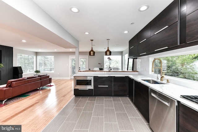 2432 S Culpeper St, Arlington, VA 22206 - kitchen with appliances with stainless steel finishes, a sink, recessed lighting, open floor plan, and a peninsula