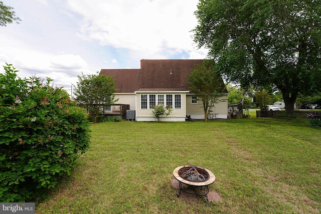 20560 Nanticoke Rd, Nanticoke, MD 21840 - back of house with a fire pit, central air condition unit, and a shingled roof