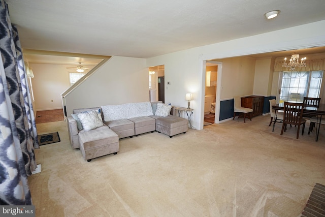 20560 Nanticoke Rd, Nanticoke, MD 21840 - carpeted living room with a chandelier, a ceiling fan, and baseboards