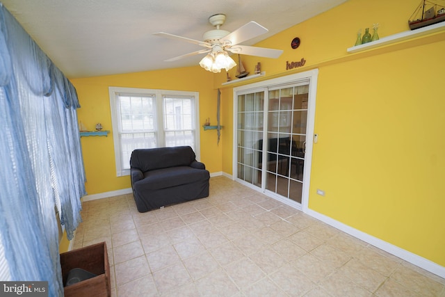 20560 Nanticoke Rd, Nanticoke, MD 21840 - living area featuring lofted ceiling, a ceiling fan, tile patterned flooring, and baseboards
