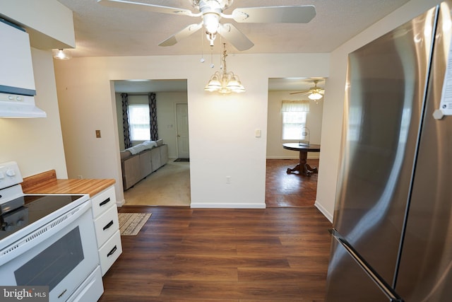 20560 Nanticoke Rd, Nanticoke, MD 21840 - kitchen featuring freestanding refrigerator, white electric range, white cabinetry, a ceiling fan, and dark wood-style floors