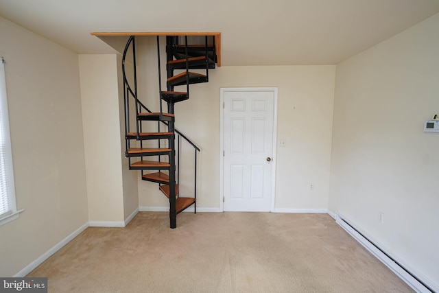 20560 Nanticoke Rd, Nanticoke, MD 21840 - below grade area with a baseboard heating unit, carpet, stairway, and baseboards