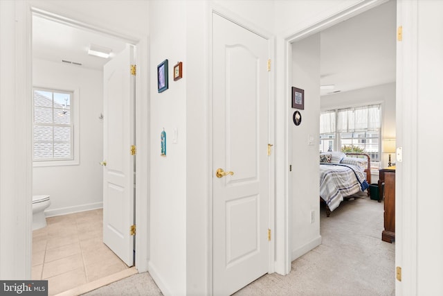 201 Henrys Mill Dr, Berlin, MD 21811 - corridor featuring baseboards and light tile patterned flooring