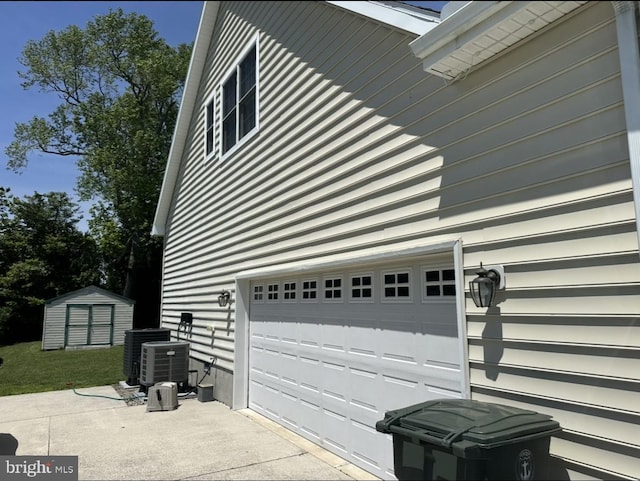201 Henrys Mill Dr, Berlin, MD 21811 - garage featuring a storage shed and central AC unit