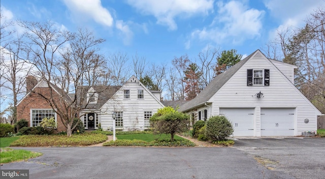 607 Rosedale Rd, Princeton, NJ 08540 - view of home's exterior with a garage, asphalt driveway, roof with shingles, and a chimney
