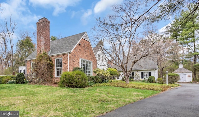 607 Rosedale Rd, Princeton, NJ 08540 - view of property exterior with brick siding, a chimney, a lawn, and roof with shingles