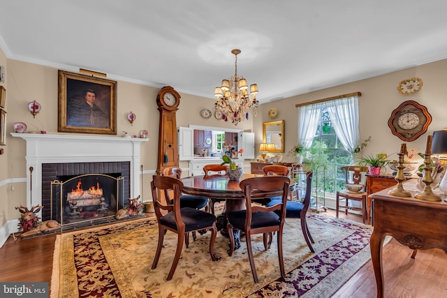 607 Rosedale Rd, Princeton, NJ 08540 - dining area featuring wood finished floors, a chandelier, a fireplace, and ornamental molding