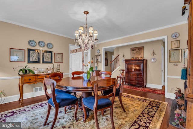 607 Rosedale Rd, Princeton, NJ 08540 - dining area featuring a chandelier, stairs, ornamental molding, wood finished floors, and baseboards