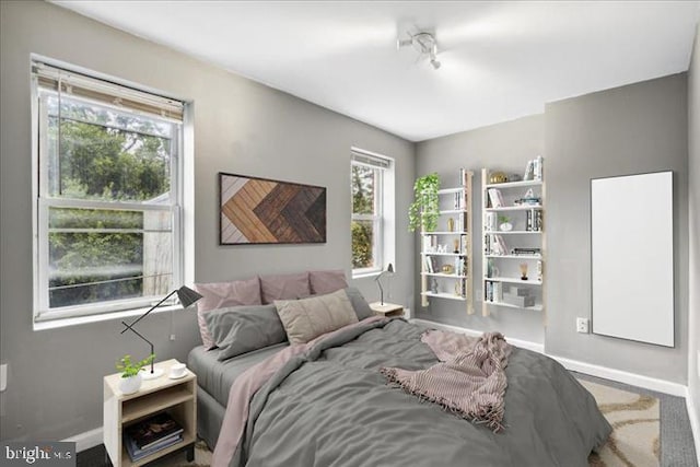 bedroom featuring baseboards