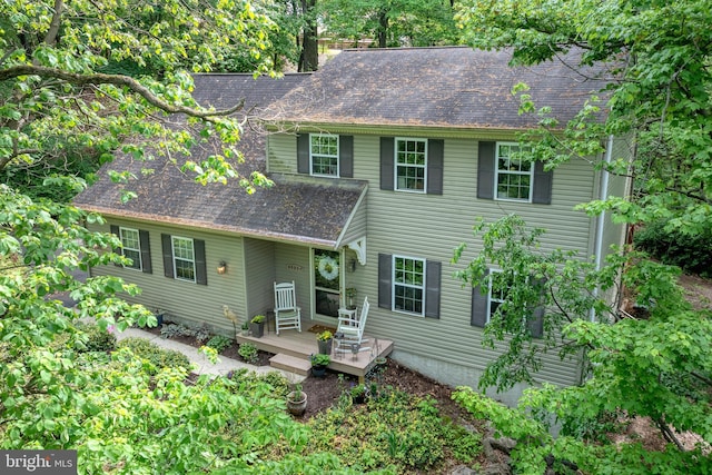 view of front of property featuring roof with shingles