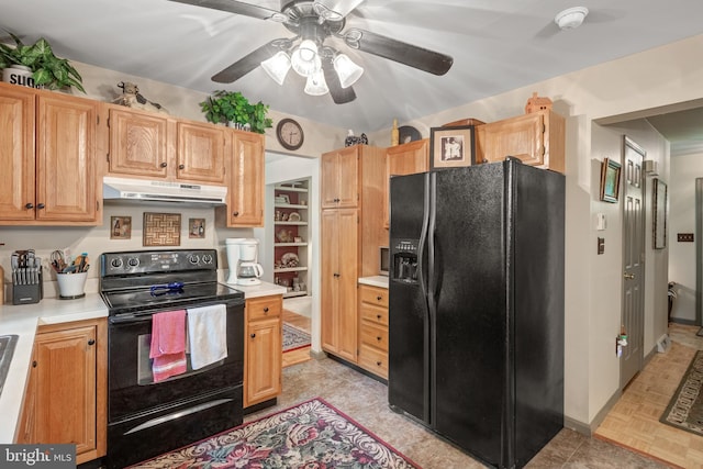 kitchen with black appliances, under cabinet range hood, light countertops, and ceiling fan