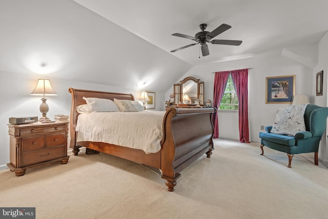 bedroom featuring carpet, lofted ceiling, and a ceiling fan