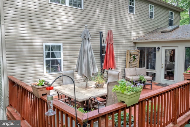 deck featuring outdoor dining space