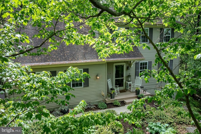 rear view of house with a wooden deck