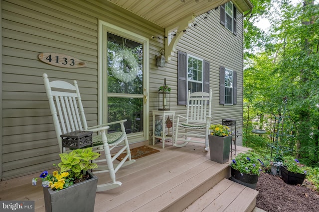 wooden deck featuring covered porch