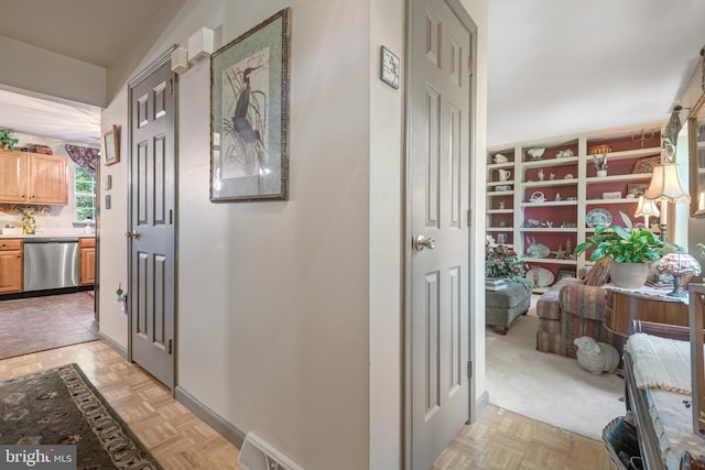 hallway featuring baseboards