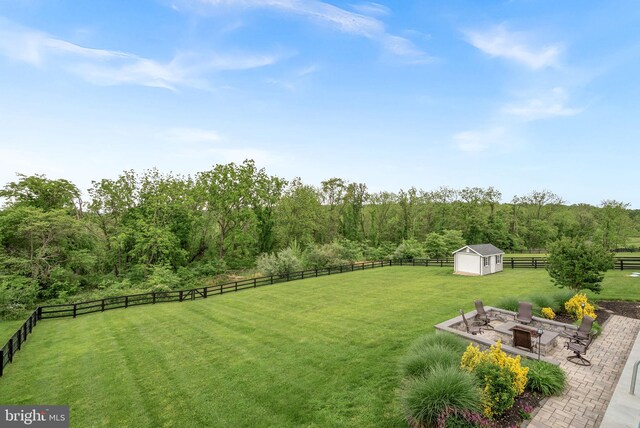 16024 Waterford Crest Pl, Paeonian Springs, VA 20129 - view of yard featuring a storage shed, an outbuilding, a fire pit, and a patio