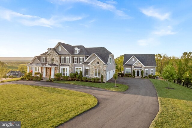 16024 Waterford Crest Pl, Paeonian Springs, VA 20129 - view of front of home featuring stone siding, asphalt driveway, a garage, and french doors