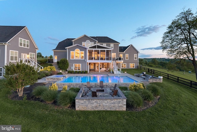 16024 Waterford Crest Pl, Paeonian Springs, VA 20129 - back of house with stairs, an outdoor fire pit, a patio, a sunroom, and an in-ground hot tub