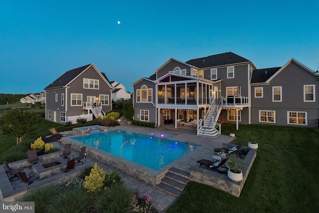16024 Waterford Crest Pl, Paeonian Springs, VA 20129 - back of property with stairway, an in-ground hot tub, a sunroom, and an outdoor fire pit