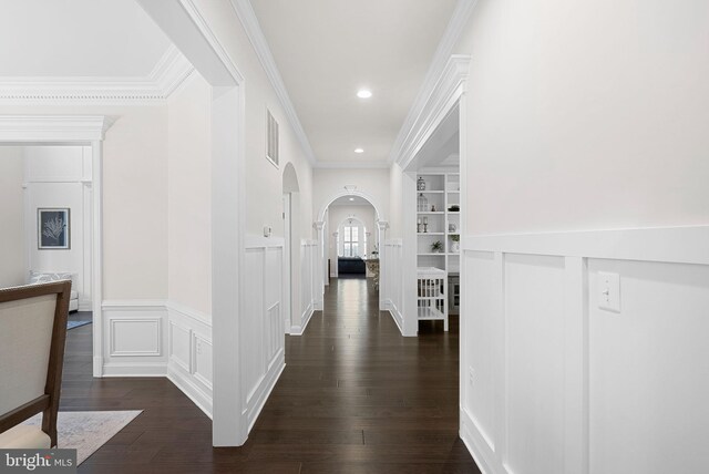 16024 Waterford Crest Pl, Paeonian Springs, VA 20129 - hall with arched walkways, ornamental molding, dark wood finished floors, wainscoting, and a decorative wall