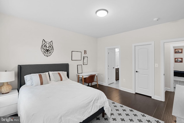 16024 Waterford Crest Pl, Paeonian Springs, VA 20129 - bedroom with wood finished floors, baseboards, and connected bathroom