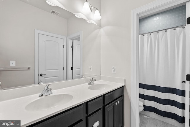 16024 Waterford Crest Pl, Paeonian Springs, VA 20129 - full bathroom featuring double vanity, toilet, and a shower with curtain
