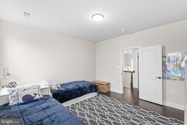 16024 Waterford Crest Pl, Paeonian Springs, VA 20129 - bedroom featuring dark wood-style floors and baseboards