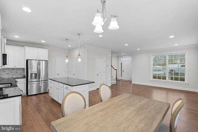 16024 Waterford Crest Pl, Paeonian Springs, VA 20129 - dining room with a chandelier, stairway, recessed lighting, dark wood-style flooring, and baseboards