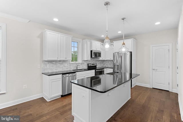 16024 Waterford Crest Pl, Paeonian Springs, VA 20129 - kitchen with stainless steel appliances, dark wood-style flooring, white cabinetry, tasteful backsplash, and recessed lighting